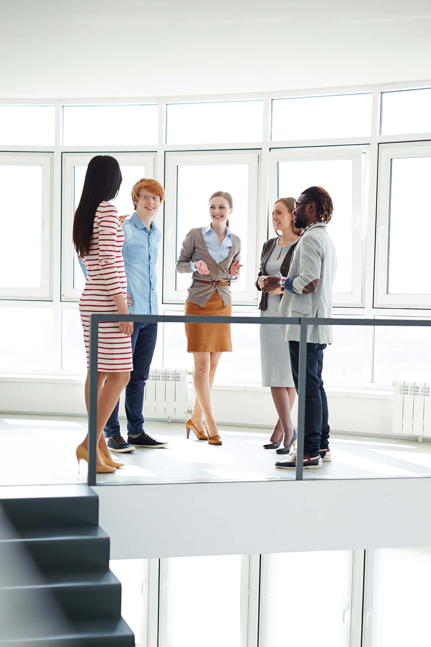 circle of employees in a bright office
