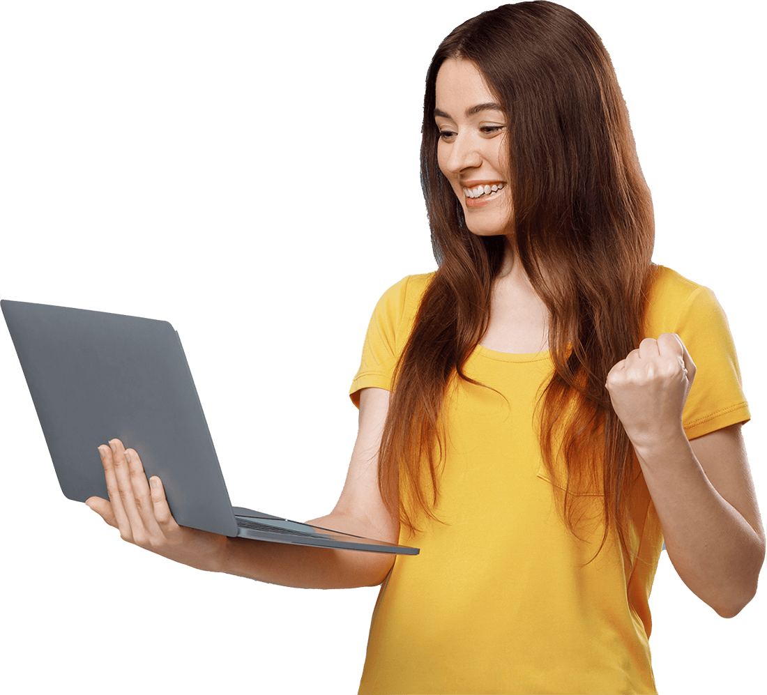 emotional young woman with laptop raising fists up